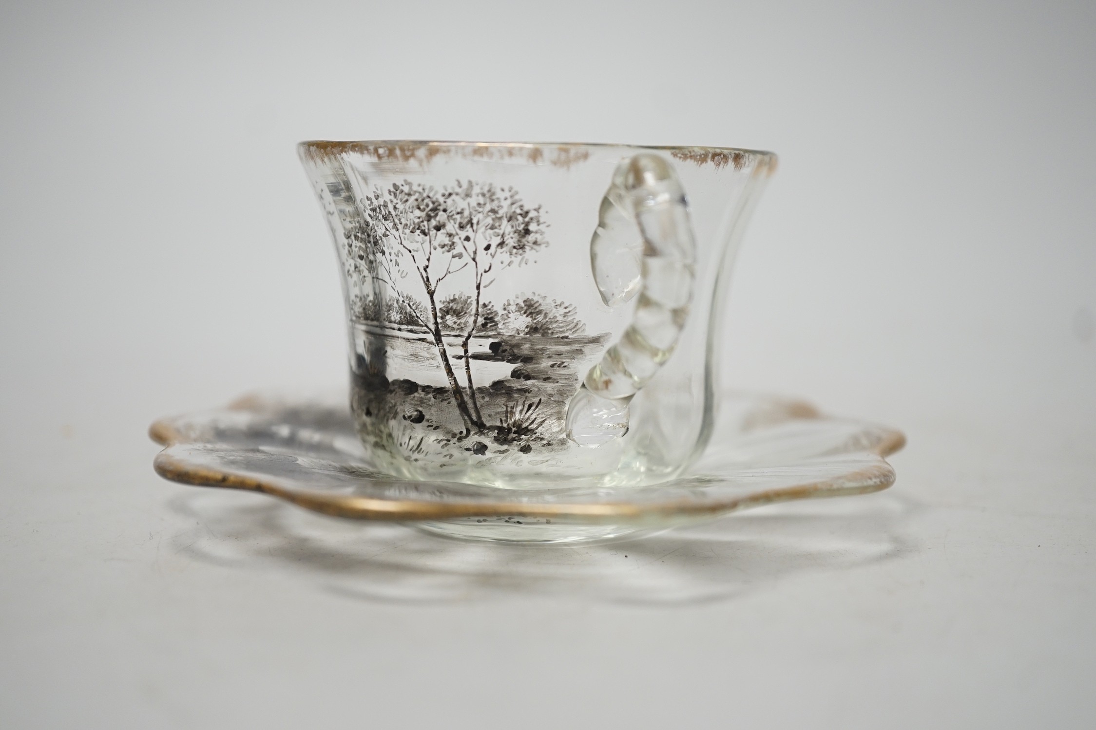 An unusual Emile Galle enamelled miniature glass cup and saucer. 6cm tall